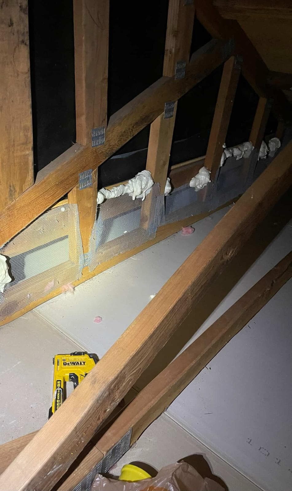 crevices and spaces being filled in by spray insulation