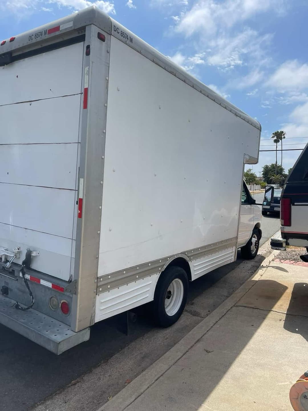 Holiday exterior lighting installation on residential home at night